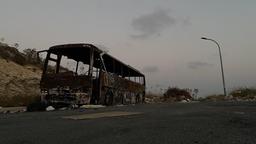 [1920x1080] Burnt bus among piles of trash with a sunset in the backround giving post-apocalyptic vibes. Picture taken on an iPhone 11 by me.