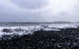 Wave kicking up rocks at Reynisfjara Beach [OC] [3840x2400]